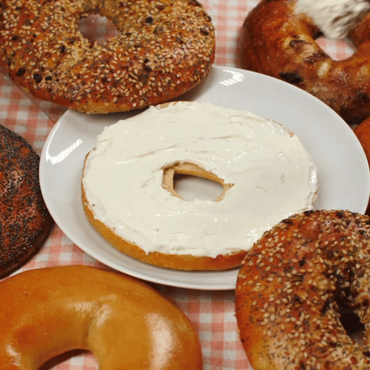 flat bagel sliced with cream cheese