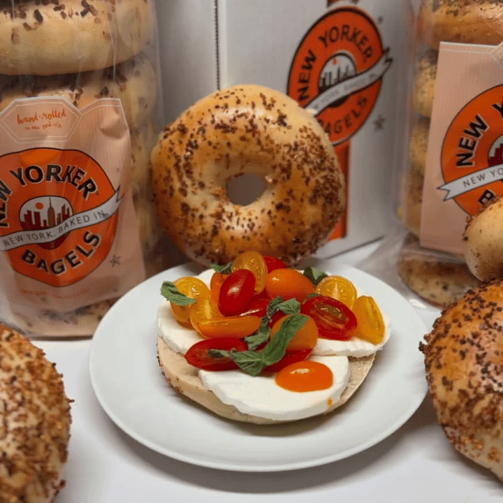 garlic bagel with fresh mozzarella and peppers