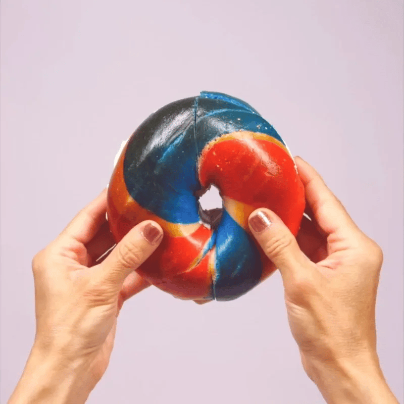 red white and blue bagel with cream cheese