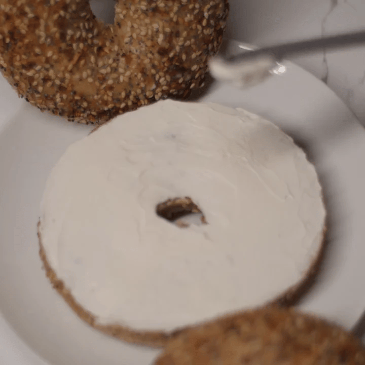 whole wheat everything bagel with cream cheese