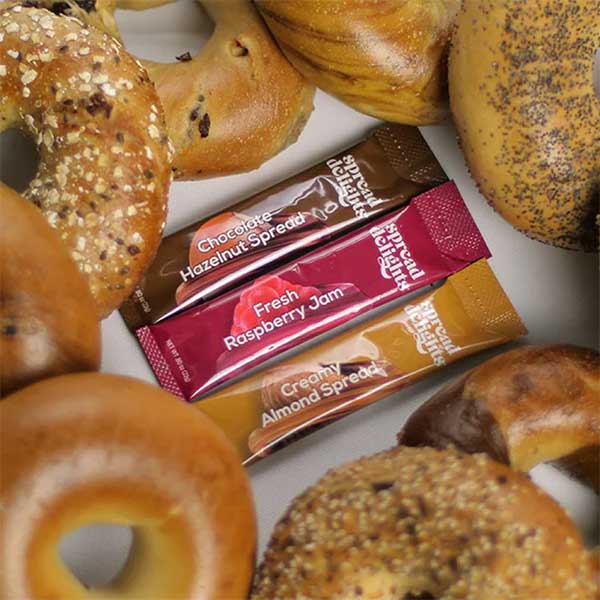 Chocolate, Raspberry and Almond spreads surrounded by mixed bagels